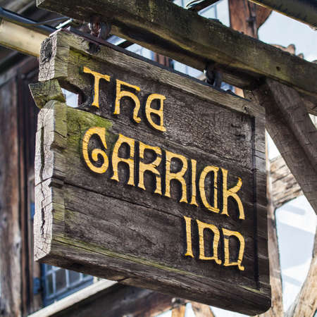 STRATFORD-UPON-AVON, UK - MARCH 2ND 2017: The sign above the main entrance to the Garrick Inn Public House in Stratford-Upon-Avon, on 2nd March 2017.  It is reputedly the oldest pub in the town.のeditorial素材