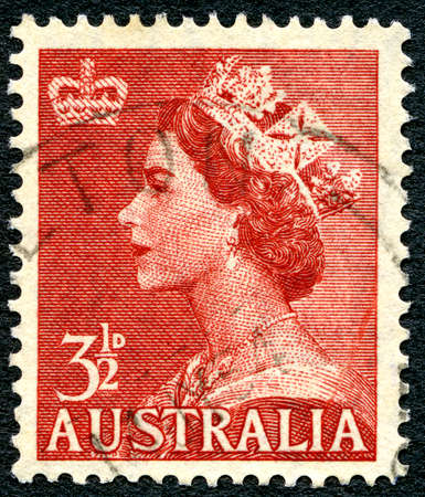 AUSTRALIA - CIRCA 1956: A used postage stamp from Australia, depicting a portrait of Queen Elizabeth II, circa 1956.のeditorial素材