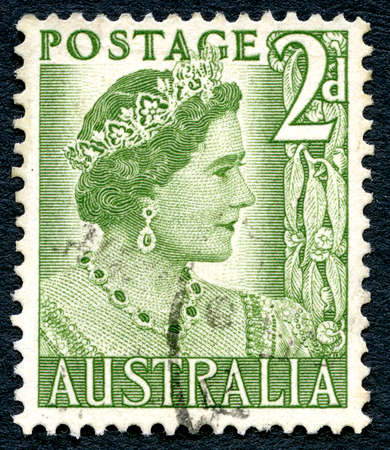 AUSTRALIA - CIRCA 1950: A used postage stamp from Australia, depicting a portrait of Elizabeth Bowes Lyon, later affectionately known as the Queen Mother, circa 1950.のeditorial素材