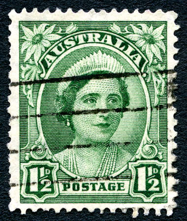 AUSTRALIA - CIRCA 1942: A used postage stamp from Australia, depicting a portrait of Elizabeth Bowes Lyon, later affectionately known as the Queen Mother, circa 1942.のeditorial素材