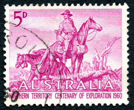 AUSTRALIA - CIRCA 1960: A used postage stamp from Australia, depicting an illustration of an Overlander and celebrating 100 years of Northern Territory Exploration, circa 1960.のeditorial素材