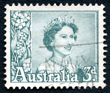 AUSTRALIA - CIRCA 1959: A used postage stamp from Australia, depicting a portrait of Queen Elizabeth II, circa 1959.のeditorial素材