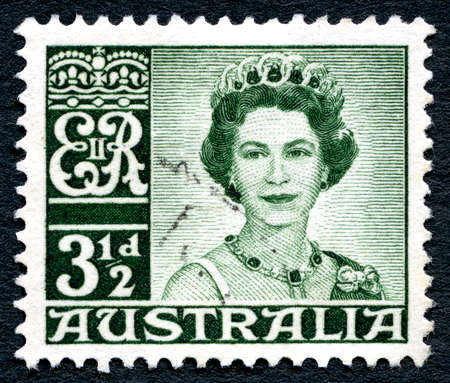 AUSTRALIA - CIRCA 1959: A used postage stamp from Australia, depicting a portrait of Queen Elizabeth II, circa 1959.のeditorial素材