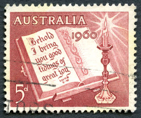 AUSTRALIA - CIRCA 1960: A used postage stamp from Australia, depicting a religious message from Luke 2:10 to celebrate Christmas, circa 1960.のeditorial素材