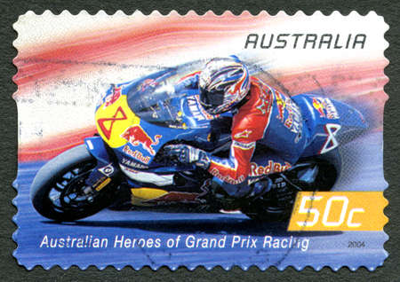 AUSTRALIA - CIRCA 2004: A used postage stamp from Australia celebrating Australian Heroes of Grand Prix Racing, with an image of Garry McCoy, circa 2004.のeditorial素材