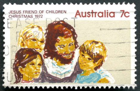 AUSTRALIA - CIRCA 1972: A used postage stamp from Australia, portraying an illustration and caption Jesus Friend of Children - commemorating Christmas, circa 1972.のeditorial素材