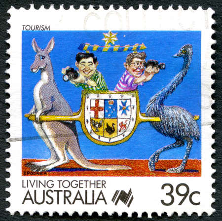 AUSTRALIA - CIRCA 1988: A used postage stamp from Australia, promoting Living together and celebrating the Australian Tourism industry, circa 1988.のeditorial素材