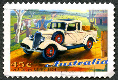 AUSTRALIA - CIRCA 1997: A used postage stamp from Australia, depicting an illustration of a Ford Coupe Utility 1934 automobile, circa 1997.のeditorial素材