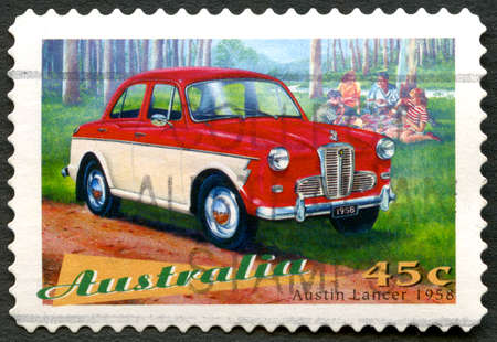 AUSTRALIA - CIRCA 1997: A used postage stamp from Australia, depicting an illustration of an Austin Lancer 1958 automobile, circa 1997.のeditorial素材