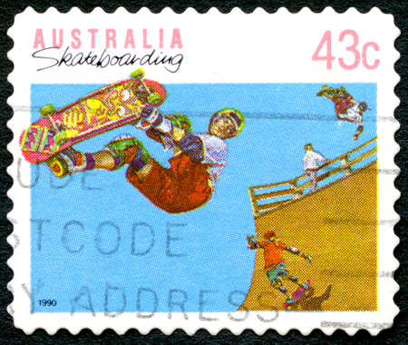 AUSTRALIA - CIRCA 1990: A used postage stamp from Australia, celebrating the leisure activity of Skateboarding, circa 1990.のeditorial素材