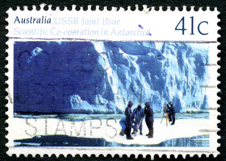 AUSTRALIA - CIRCA 1990: A used postage stamp from Australia, commemorating Australia and USSRs scientific co-operation in Antarctica, circa 1990.のeditorial素材