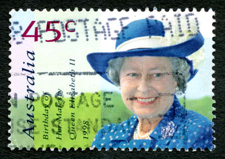 AUSTRALIA - CIRCA 1998: A used postage stamp from Australia, depicting a portrait of Queen Elizabeth II to celebrate her birthday, circa 1998.のeditorial素材