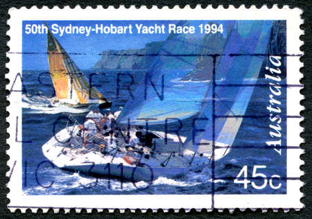 AUSTRALIA - CIRCA 1994: A used postage stamp from Australia, commemorating the 50th Sydney to Hobart Yacht Race, circa 1994.のeditorial素材