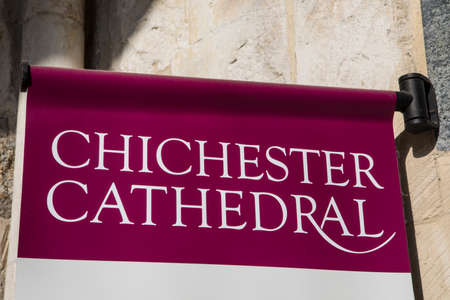 A sign at the main entrance to the historic Chichester Cathedral in West Sussex, UK.のeditorial素材