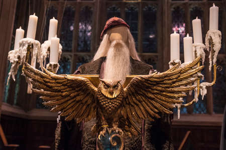 LEAVESDEN, UK - JUNE 19TH 2017: The golden Owl Lecturn on the set of the Great Hall at Hogwarts, at the Making of Harry Potter studio tour at the Warner Bros studios in Leavesden, UK, on 19th June 2017.のeditorial素材
