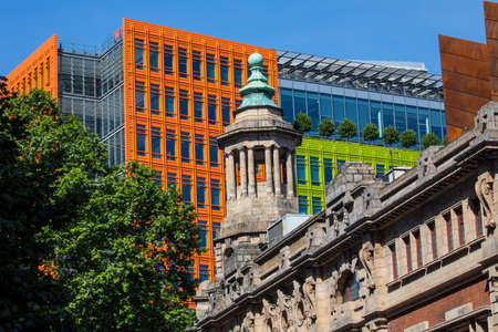 The tower of the famous Shaftesbury Theatre with the bright coloured facade of Central Saint Giles in the background in central London.のeditorial素材