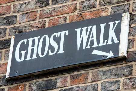 A sign for a Ghost Walk in the historic and haunted city of York in England.の写真素材