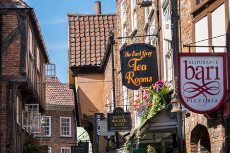 YORK, UK - JULY 18TH 2017: A view of the variety of shops and restaurants on The Shambles in the historic city of York, UK, on 18th July 2017.のeditorial素材