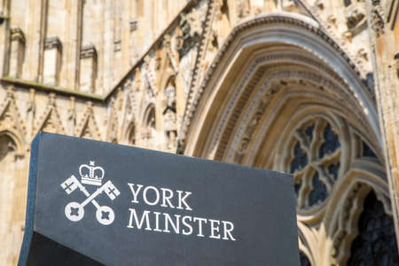 YORK, UK - JULY 19TH 2017: The sign at the entrance to the historic York Minster in the city of York in England, on 19th July 2017.のeditorial素材