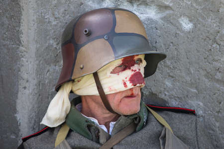 KENT, UK - AUGUST 28TH 2017: An actor posing as a wounded German soldier from the First World War, at the Military Odyssey Re-enactment event in Detling, Kent, on 28th August 2017.のeditorial素材