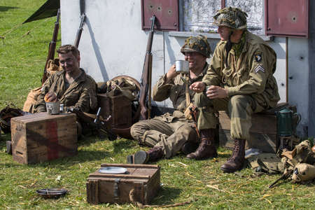 KENT, UK - AUGUST 28TH 2017: Actors posing as American soldiers from the 2nd World War, at the Military Odyssey Re-enactment event in Detling, Kent, on 28th August 2017.のeditorial素材