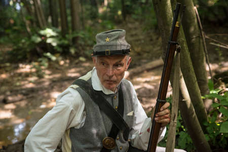KENT, UK - AUGUST 28TH 2017: Actor posing as a Confederate soldier from the American Civil War, at the Military Odyssey Re-enactment event in Detling, Kent, on 28th August 2017.のeditorial素材