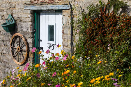 DORSET, UK - AUGUST 16TH 2017: A pretty rural cottage in an English village, on 16th August 2017.のeditorial素材