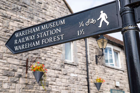 A direction sign pointing out nearby landmarks in Wareham, located in the beautiful county of...