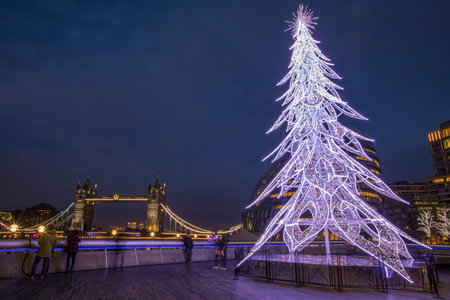 A view of Tower Bridge and a festive Christmas Tree in London, UK.のeditorial素材