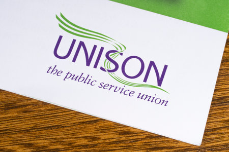 LONDON, UK - DECEMBER 18TH 2017: Close-up of the UNISON logo on a leaflet, on 18th December 2017.  UNISON is the second largest trade union in the UK.のeditorial素材