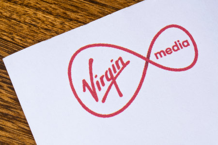 LONDON, UK - DEC 18TH 2017: Close-up of the Virgin Media logo on the top of a letterhead, on 18th December 2017.  Virgin Media is a British company providing telephone, television and broadband services in the UK.のeditorial素材