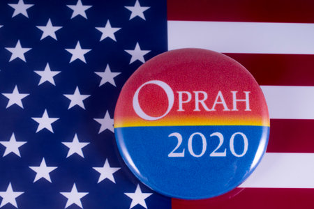LONDON, UK - MARCH 18TH 2018: An Oprah 2020 badge over the USA flag, symbolizing potential Oprah Winfrey candidacy to run for President in 2020, taken on 18th March 2018.のeditorial素材