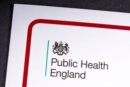 LONDON, UK - MARCH 27TH 2018: A close-up of the Public Health England icon on an information leaflet, on 27th March 2018.  Public Health England is an executive agency of the Department of Health and Social Care.のeditorial素材