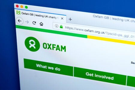 LONDON, UK - FEBRUARY 22ND 2018: The homepage of the official Website for Oxfam - the confederation of independent charitable organizations around the world, on 22nd February 2018.のeditorial素材
