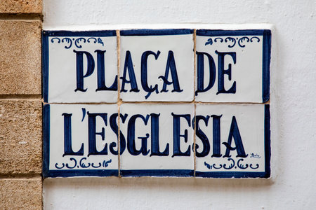 The street sign for Placa de Lâesglesia in the historic old town of Xabia.の写真素材