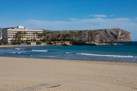 XABIA, SPAIN - APRIL 10TH 2018: A view of Cap de Sant Antoni from the Arenal beach in Javea - also known as Xabia, in Spain, on 10th April 2018.のeditorial素材