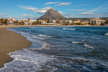 XABIA, SPAIN - APRIL 12TH 2018: A view of the magnificent Arenal beach in Javea, Spain, on 12th April 2018.  Montgo mountain is seen in the distance.  It is also known as Elephant Mountain and Montgo Massif.のeditorial素材