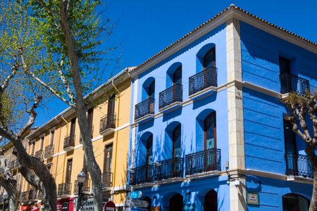 DENIA, SPAIN - APRIL 12TH 2018: Colourful architecture in the city of Denia in Spain, on 12th April 2018.のeditorial素材