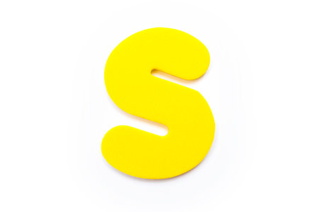Yellow Letter S over a white background.の写真素材