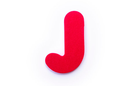 Red Letter J over a white background.の写真素材