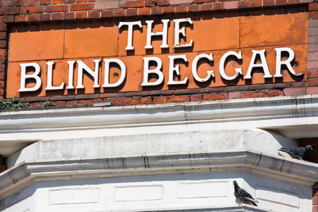 LONDON, UK - APRIL 19TH 2018: The original lettering on the exterior of The Blind Beggar public house on Whitechapel Road in London, on 18th April 2018. Its known to be the location of the murder of George Cornell by Ronnie Kray.のeditorial素材