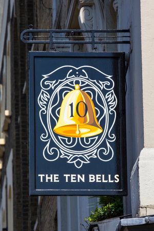 LONDON, UK - APRIL 19TH 2018: The sign above the entrance to The Ten Bells pub in the East End of London, on 19th April 2018.  It is famous for its association with Annie Chapman and Mary Kelly - victims of Jack the Ripper.のeditorial素材