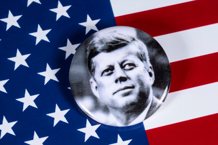 LONDON, UK - APRIL 27TH 2018: A John F. Kennedy badge pictured over the USA Flag, on 27th April 2018.  John F Kennedy was the 35th President of the United States of America.