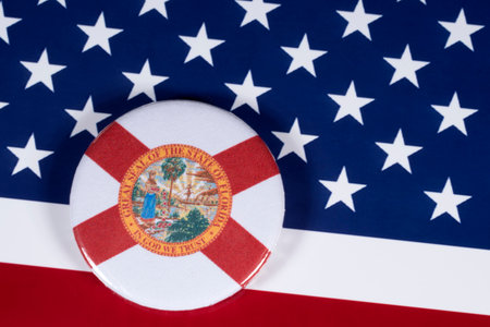 LONDON, UK - APRIL 27TH 2018: The symbol of the State of Florida, pictured over the flag of the United States of America, on 27th April 2018.のeditorial素材