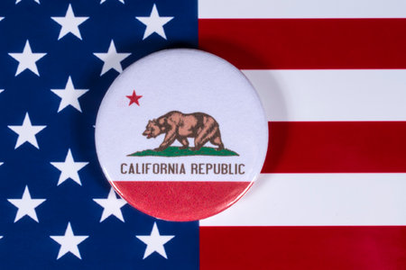LONDON, UK - APRIL 27TH 2018: The symbol of the State of California, pictured over the flag of the...