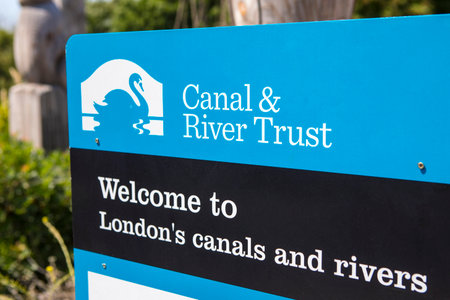 LONDON, UK - JULY 3RD 2018: A sign by the Canal and River Trust on the River Lea at Stonebridge Lock...