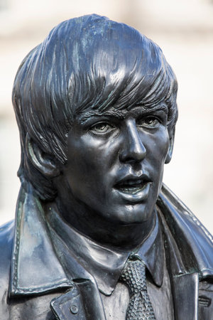 Liverpool, UK - July 30th 2018: A statue of George Harrison - one of The Beatles - located on Pier Head in the historic city of Liverpool, UK.のeditorial素材