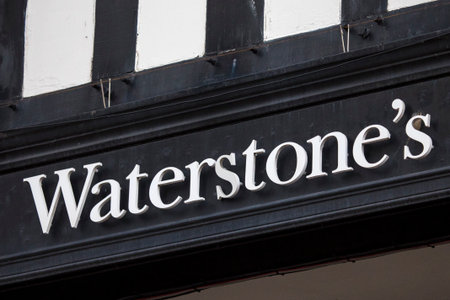 Chester, UK - July 31st 2018: The Waterstones company logo above the entrance to one of their stores in the city of Chester, UK.のeditorial素材