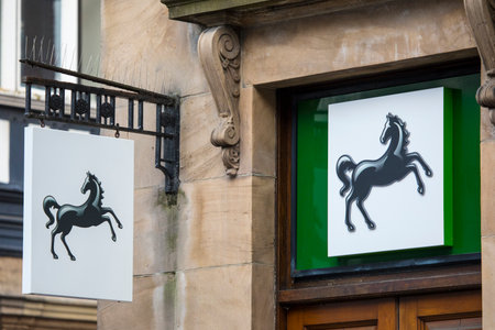 Chester, UK - August 1st 2018: Signs above the entrance to a Lloyds Bank in the city of Chester, UK.のeditorial素材