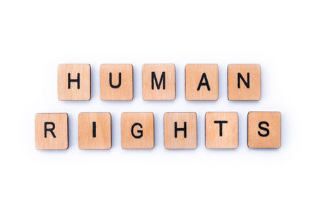 HUMAN RIGHTS, spelt with wooden letter tiles.の写真素材
